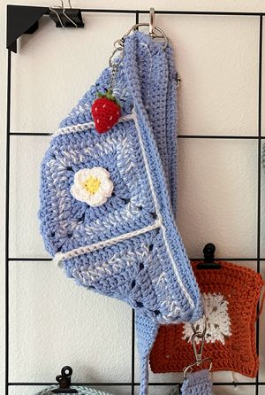 Crochet bag with strawberry keychain